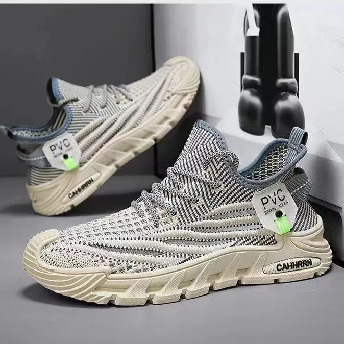 Men's flyknit mesh sneaker in black with thin sole, flat heel, and round toe on a plain background
