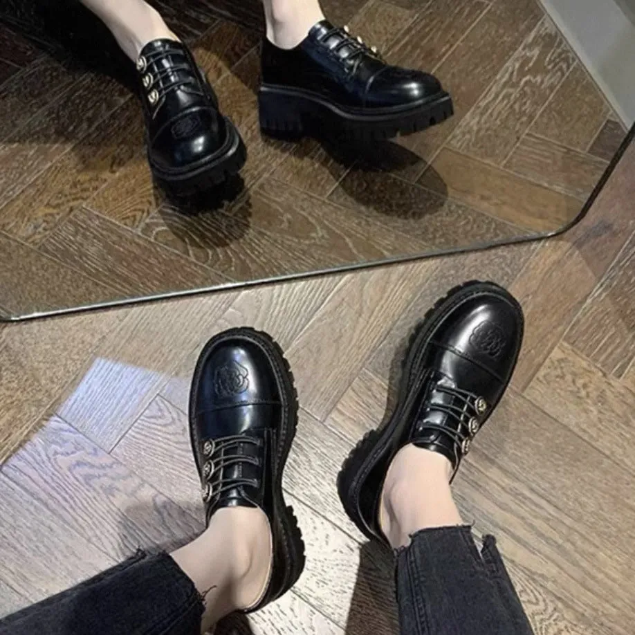 Glossy black block heel pumps with round toe and cowhide upper