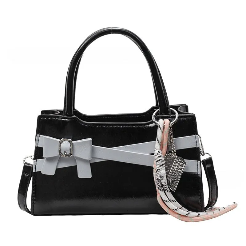 Soft nylon crossbody bag in urban simplicity, horizontal square shape, beige colour with flap pocket and stitching details.