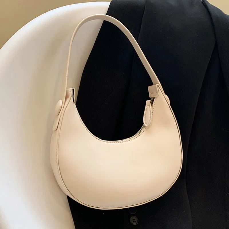 Women's retro-style PU leather shoulder bag in a dumpling shape, shown in black.
