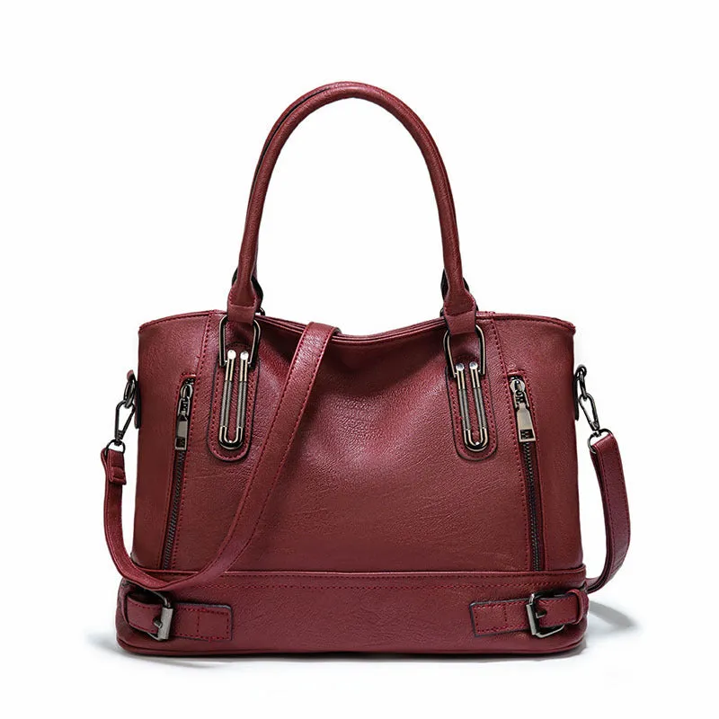 Women's PU leather handbag in black, horizontal square shape, with crossbody strap and sewing line detail