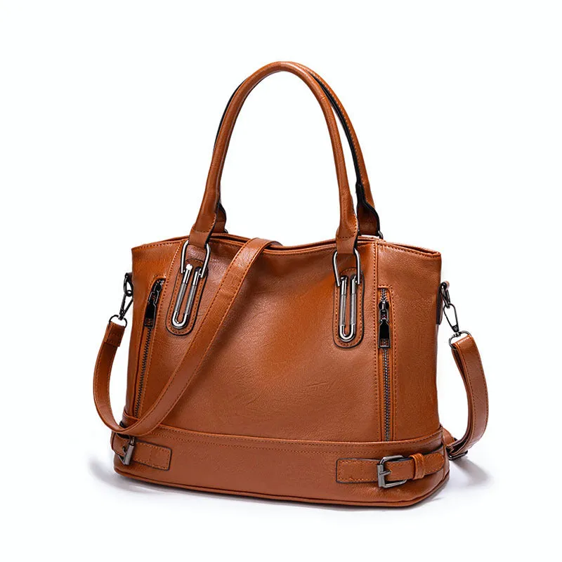 Women's PU leather handbag in black, horizontal square shape, with crossbody strap and sewing line detail