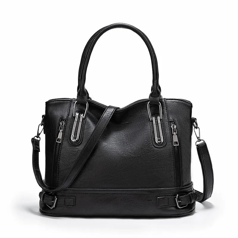 Women's PU leather handbag in black, horizontal square shape, with crossbody strap and sewing line detail