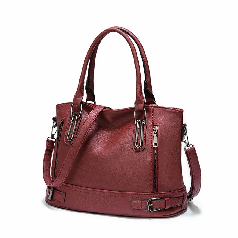 Women's PU leather handbag in black, horizontal square shape, with crossbody strap and sewing line detail