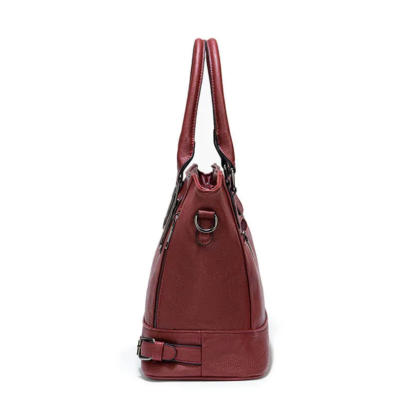 Women's PU leather handbag in black, horizontal square shape, with crossbody strap and sewing line detail