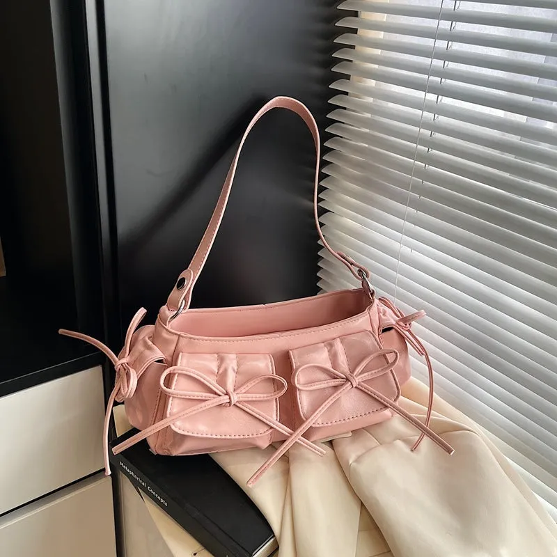 Women's shoulder bag with tassel bow decoration and multi-pocket design in various colour options