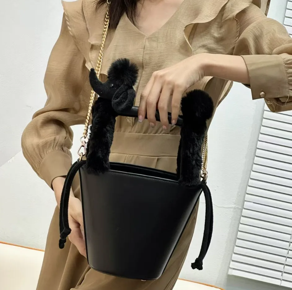 Women's PU messenger crossbody bag in black with urban simplicity style, placed on a flat surface