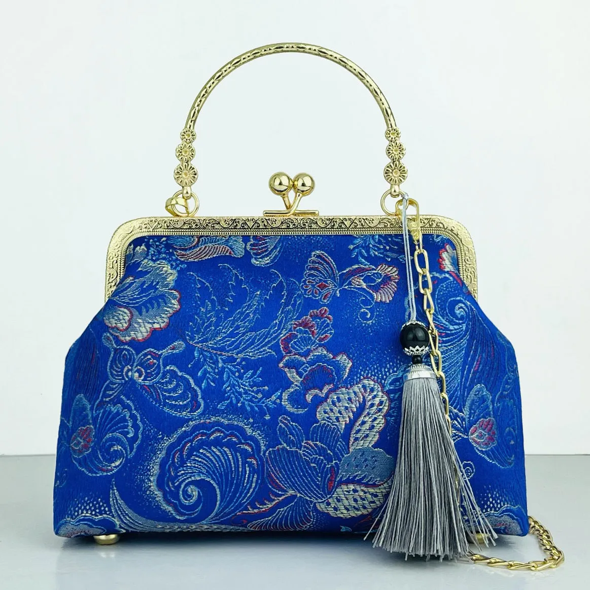 Chinese embroidery cheongsam handbag in polyester with shell shape and internal zipper compartment