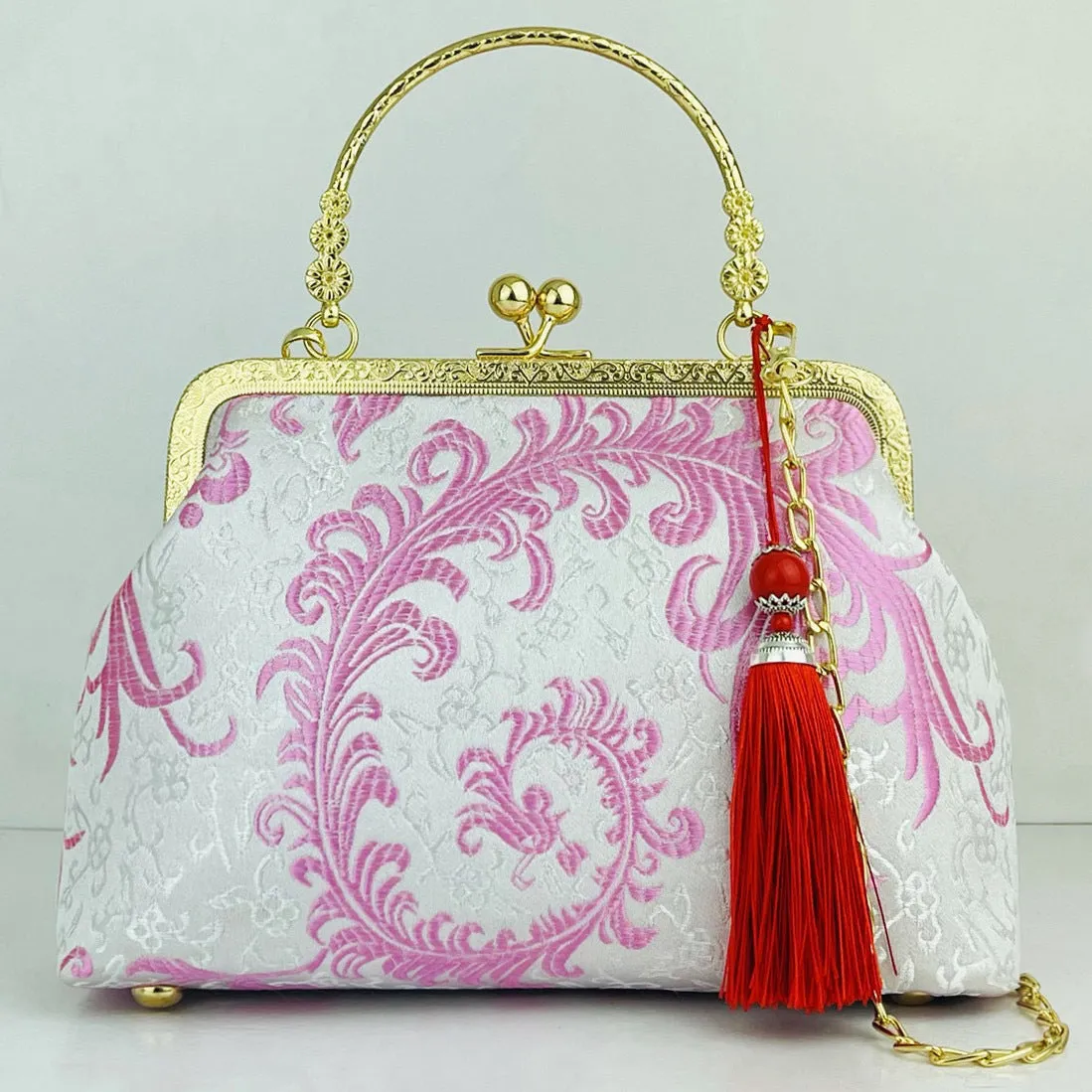 Chinese embroidery cheongsam handbag in polyester with shell shape and internal zipper compartment