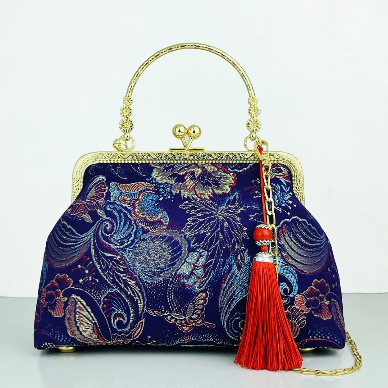 Chinese embroidery cheongsam handbag in polyester with shell shape and internal zipper compartment