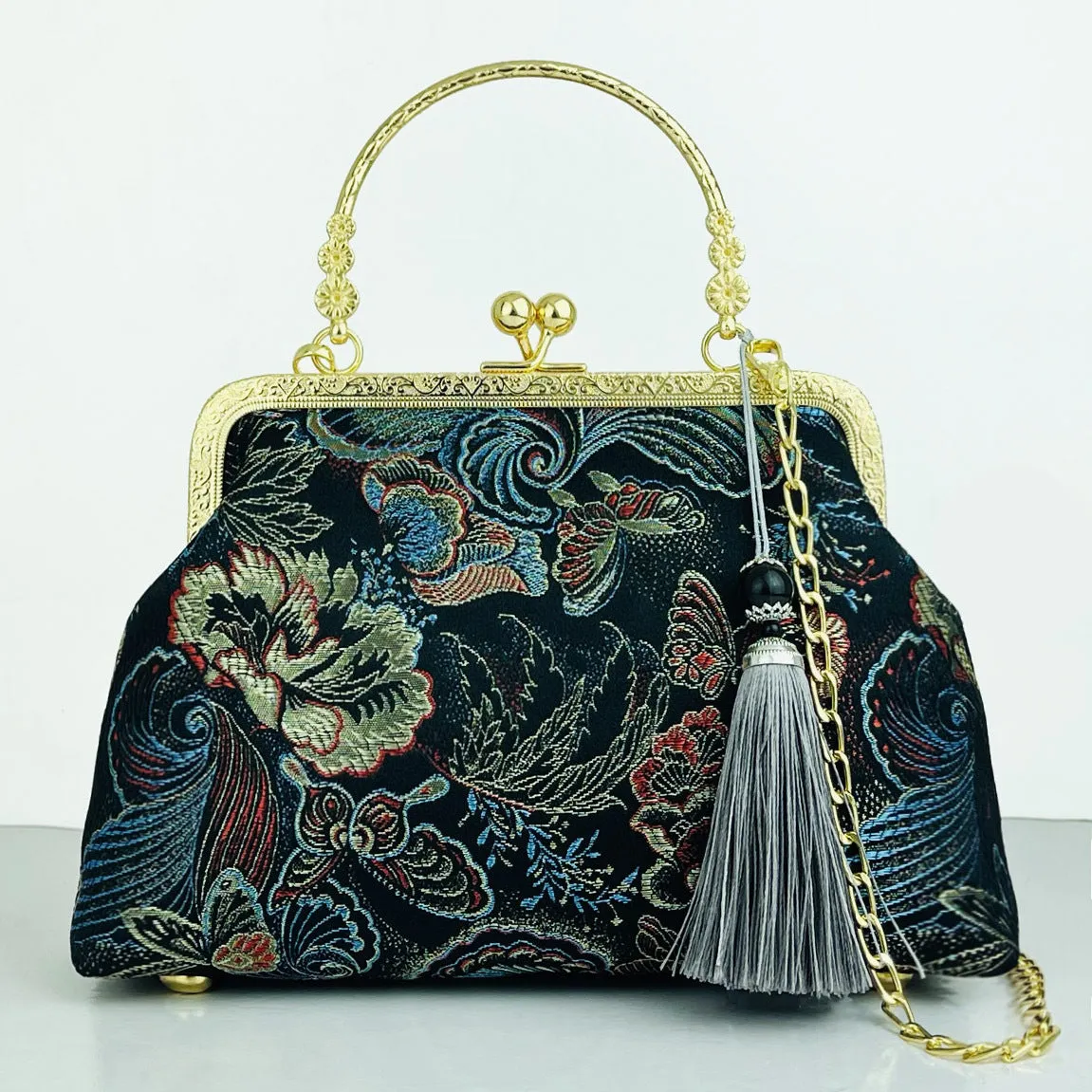 Chinese embroidery cheongsam handbag in polyester with shell shape and internal zipper compartment