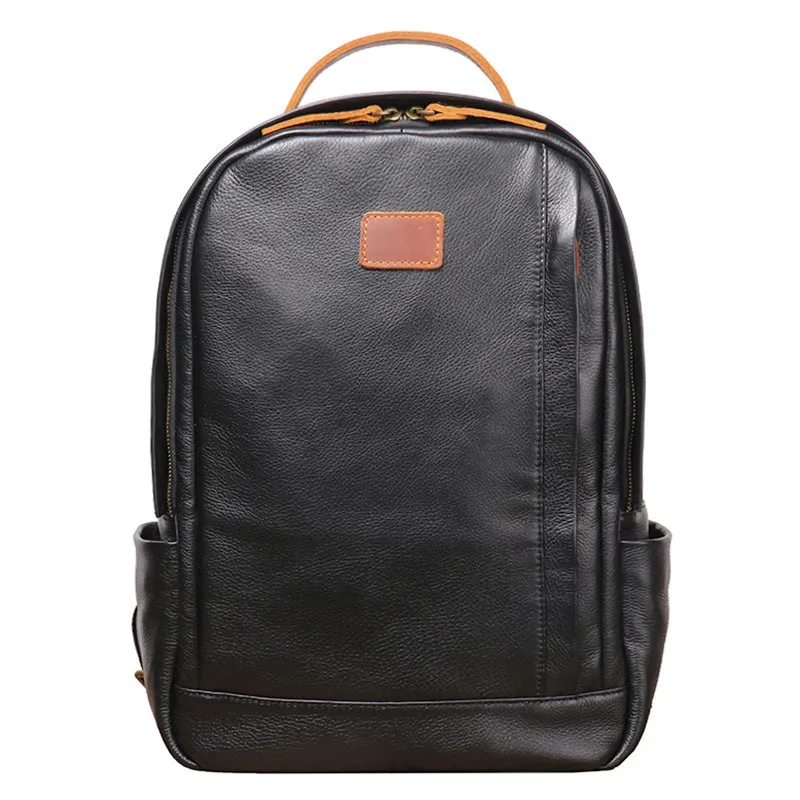 Black genuine leather expandable backpack with top grain cowhide, curved shoulder straps, and patchwork detail