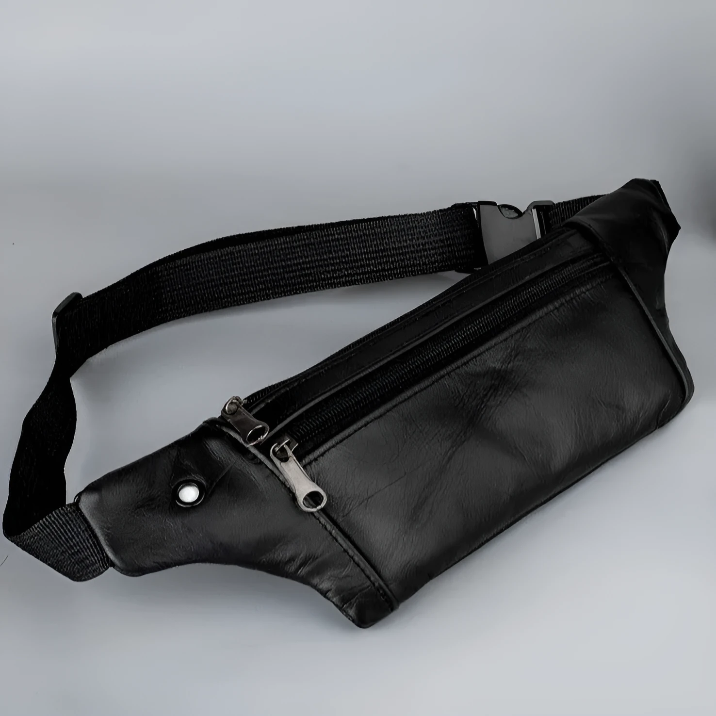 Genuine leather sports waist pack for men, black thin style, top grain leather, with leather pull tab, on white background