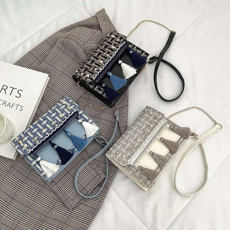 Ethnic-style horizontal square PU bag in beige with polyester lining, medium-hard structure, and flat lay on surface