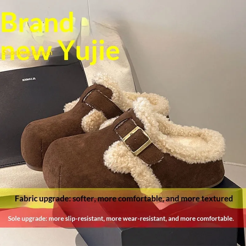 Baotou semi-drag fleece slippers in brown and camel with faux fur lining, closed toe, and rubber sole on a wooden floor