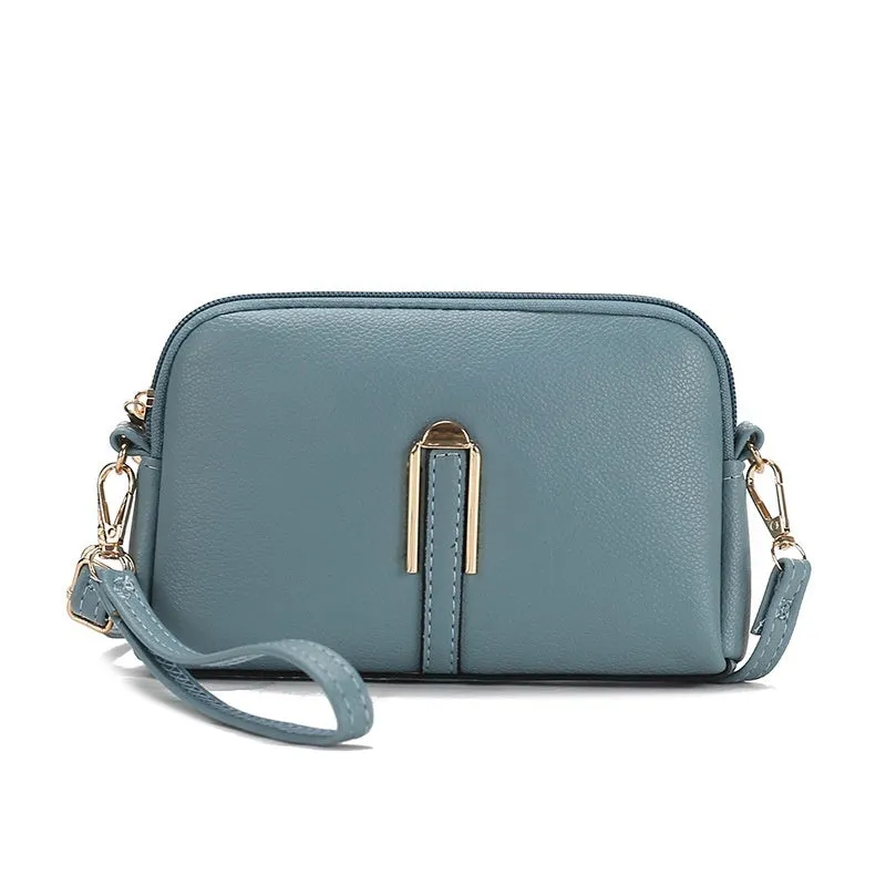 Women's solid colour PU messenger bag with stitching details and shell shape