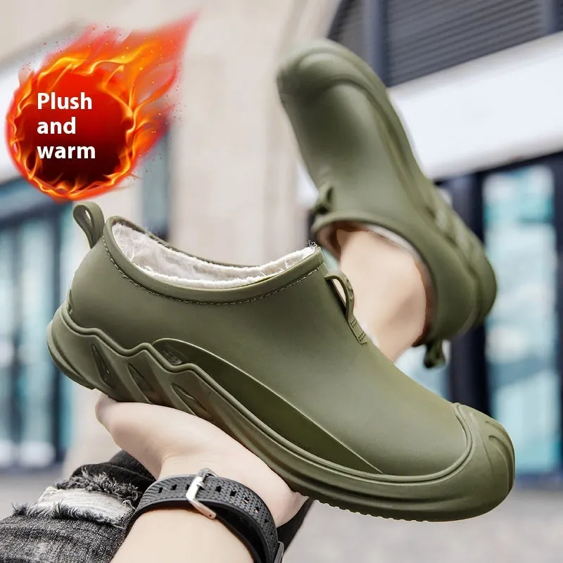 Men's black plastic rain boots showing short ankle height and solid colour design