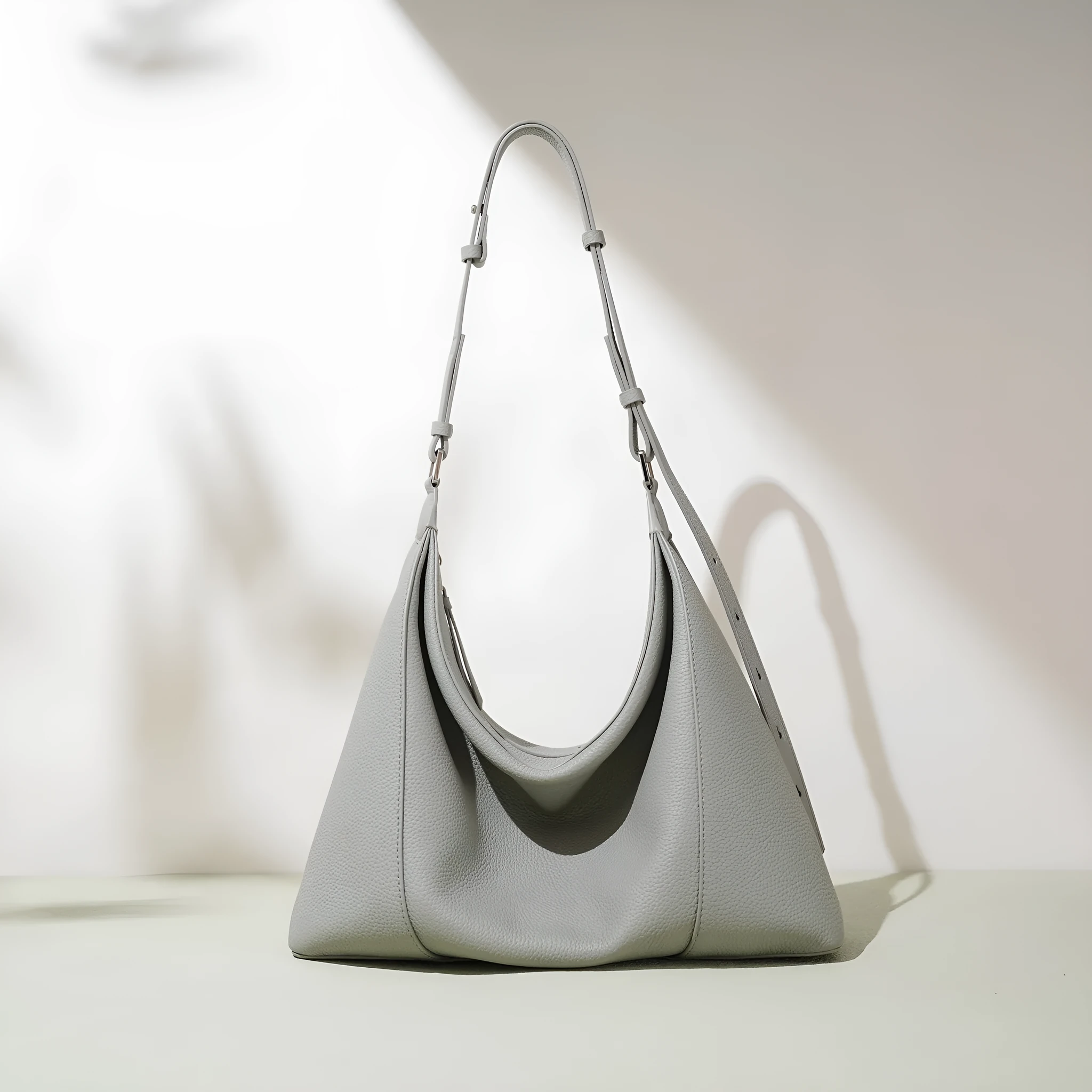 First layer cowhide soft leather shoulder bag in beige with pillow shape and open outer pocket