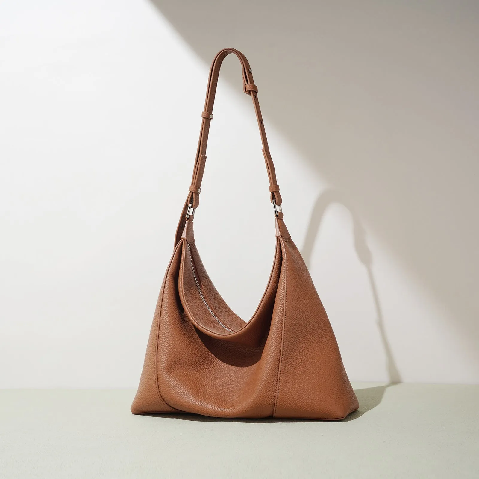 First layer cowhide soft leather shoulder bag in beige with pillow shape and open outer pocket