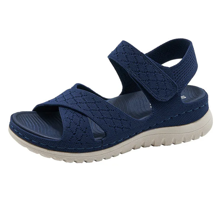 Plus size flat sandals in apricot with Flyknit upper, PVC sole, and Velcro strap.