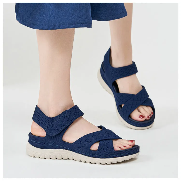 Plus size flat sandals in apricot with Flyknit upper, PVC sole, and Velcro strap.