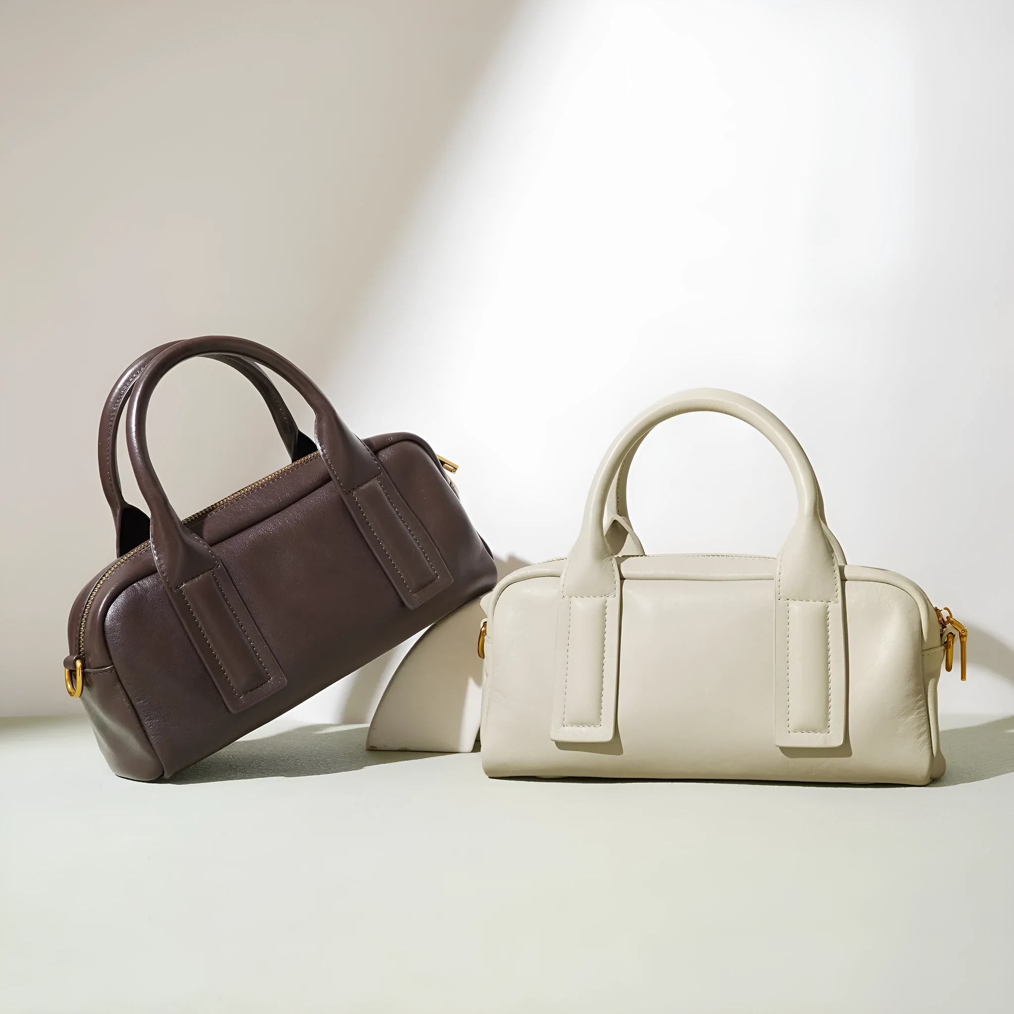 Genuine first layer cowhide crossbody bag in horizontal square shape with external sandwich pocket, available in black, brown, or milkshake white