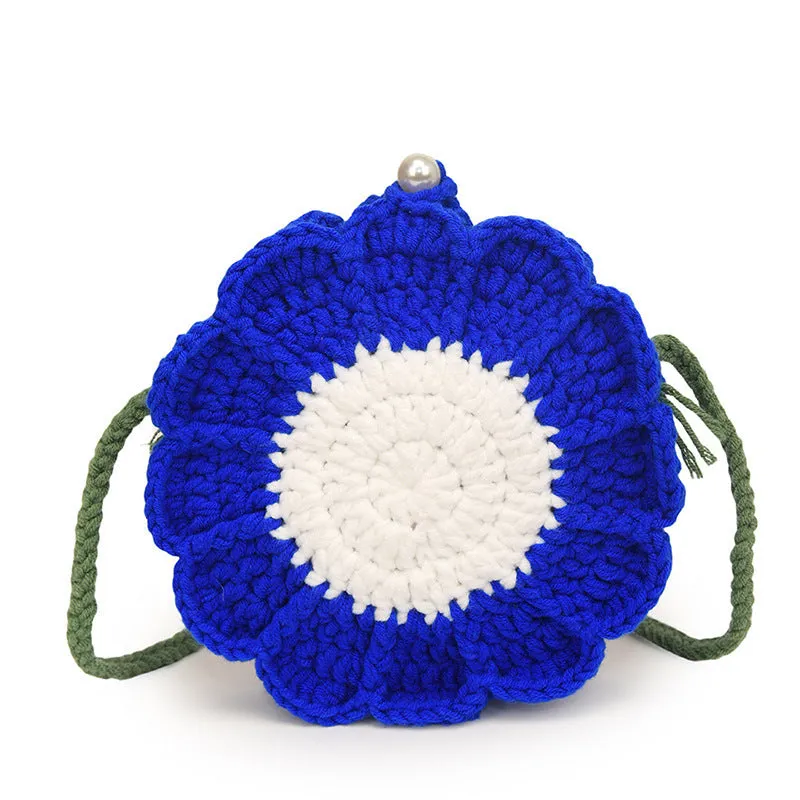 Hand-woven round bag with crocheted flowers showing cotton lining and mobile phone pouch
