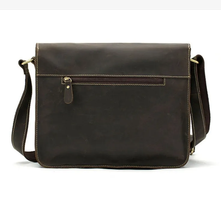 Brown genuine leather vintage messenger bag with adjustable strap, shown open to reveal internal zippered and padded pockets.