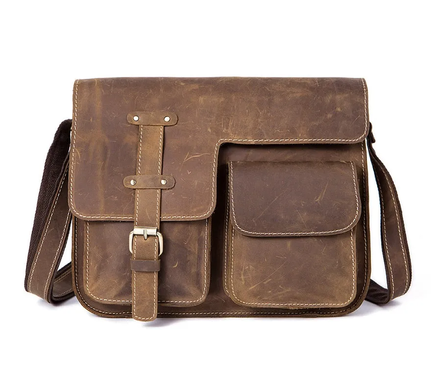Brown genuine leather vintage messenger bag with adjustable strap, shown open to reveal internal zippered and padded pockets.