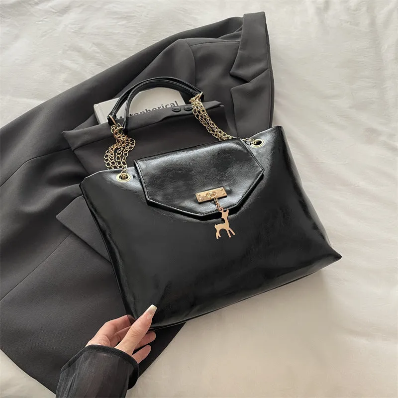 Large capacity chain shoulder bag for women in black, soft PU, horizontal square shape with chain strap
