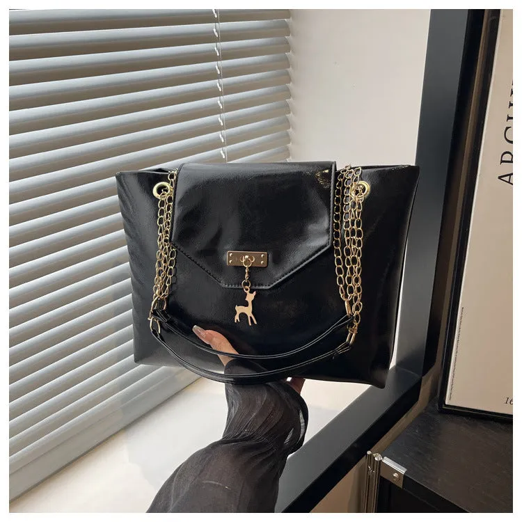 Large capacity chain shoulder bag for women in black, soft PU, horizontal square shape with chain strap