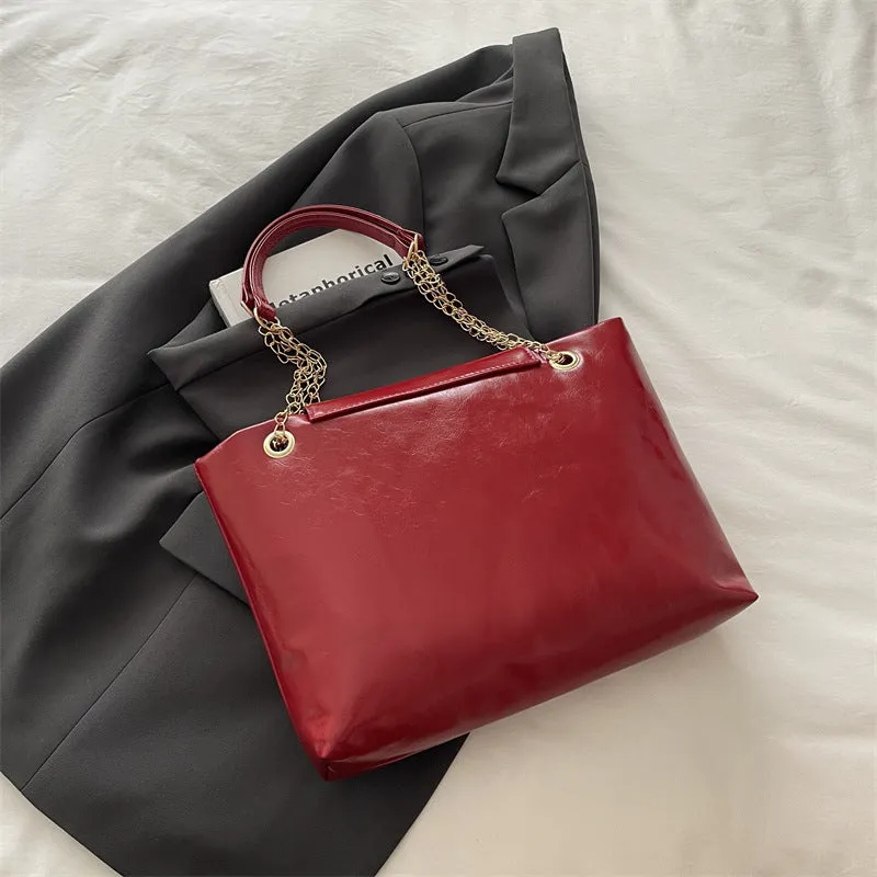 Large capacity chain shoulder bag for women in black, soft PU, horizontal square shape with chain strap
