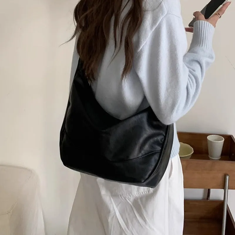 Female retro casual large capacity single shoulder crossbody bag in PU leather, brown, with sewing line detail and dumpling shape