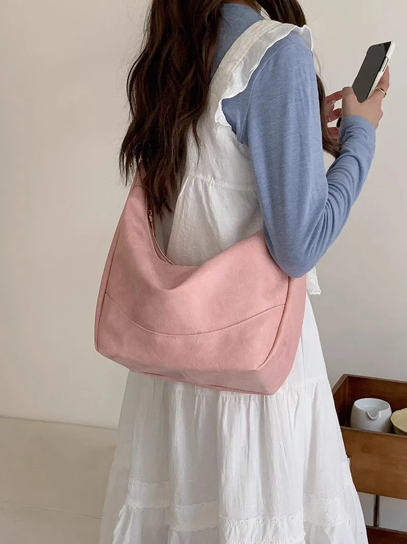 Female retro casual large capacity single shoulder crossbody bag in PU leather, brown, with sewing line detail and dumpling shape