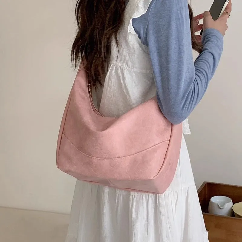 Female retro casual large capacity single shoulder crossbody bag in PU leather, brown, with sewing line detail and dumpling shape