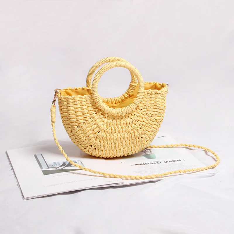 Beach mini straw bag woven dumpling shape in light blue colour with open pocket