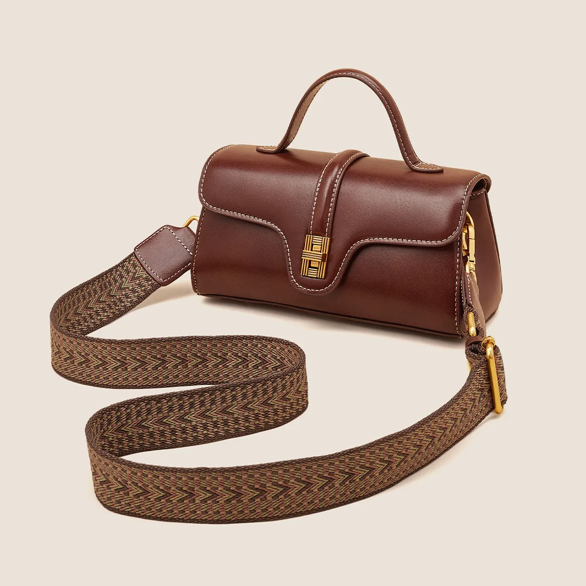 Cambridge-style leather messenger bag in clamshell design with lock detail and internal compartments