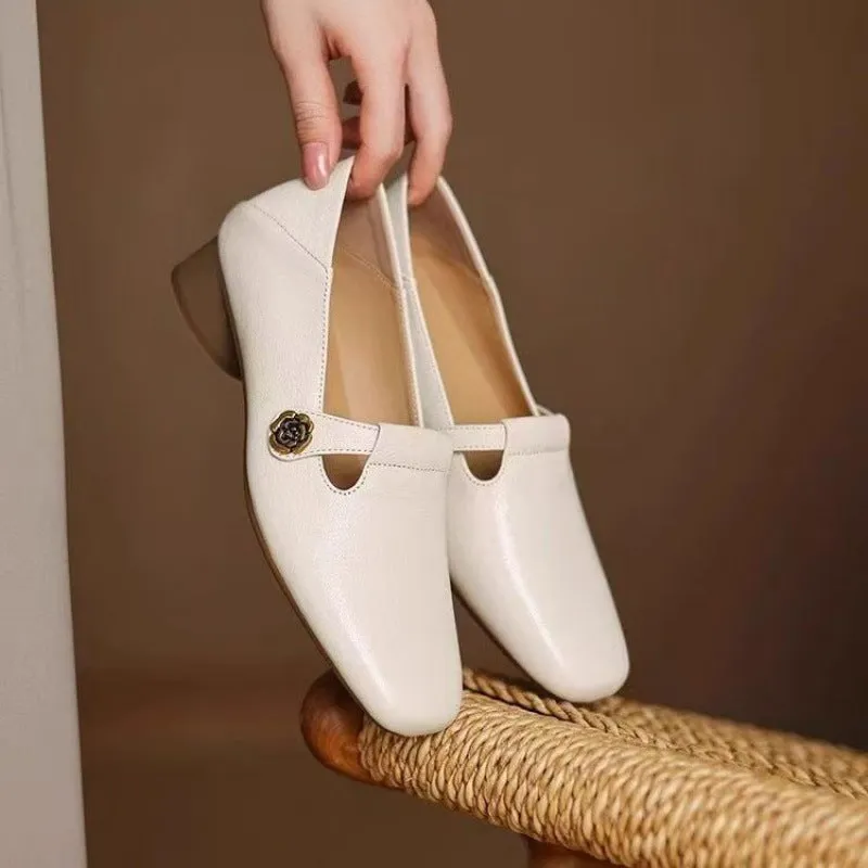 Retro square head genuine leather women shoes in beige with mid heel and square heel on a grey background