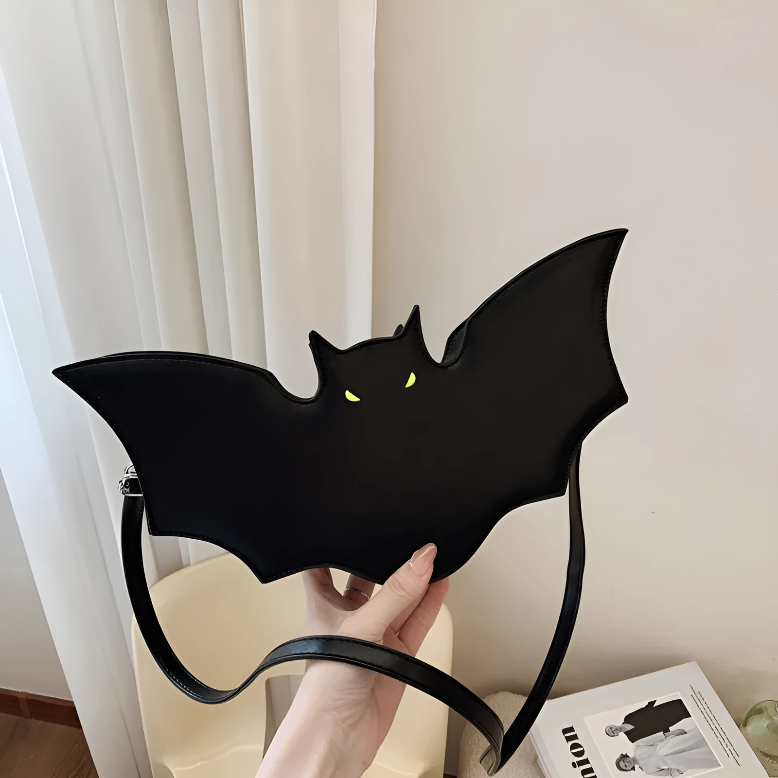Black PU Halloween bat shaped shoulder messenger bag with crossbody strap on white background