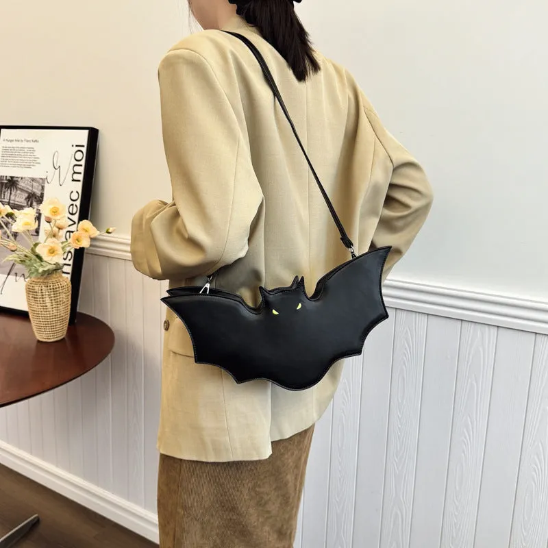 Black PU Halloween bat shaped shoulder messenger bag with crossbody strap on white background
