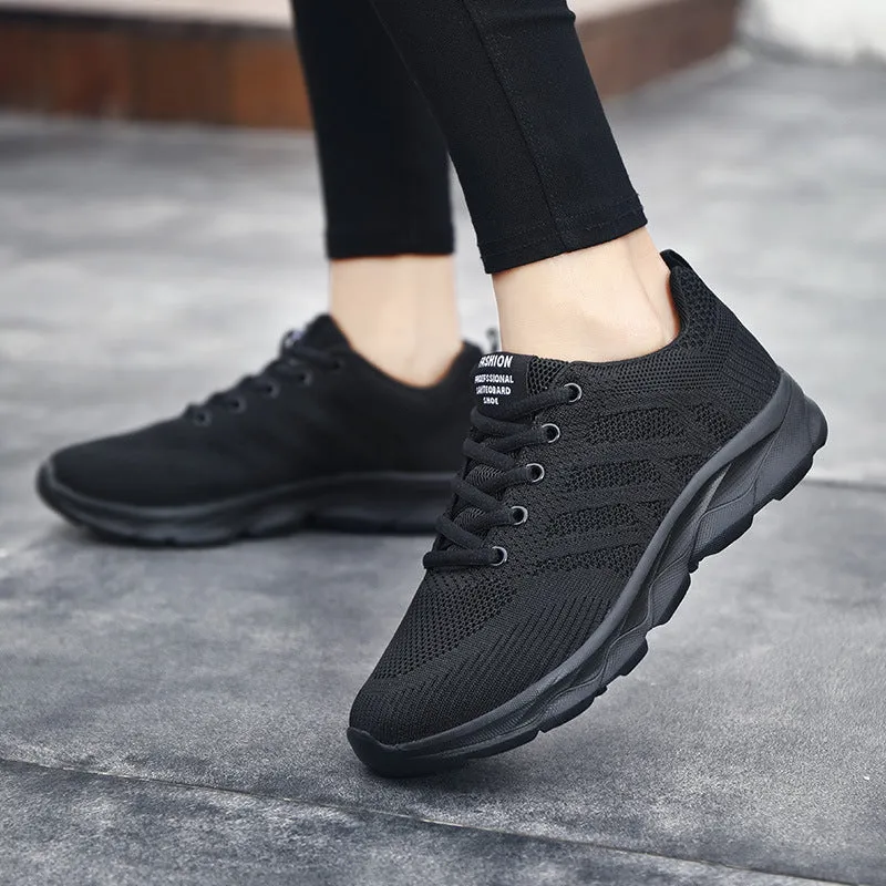 Women's sports running shoes in white with mesh and Flyknit upper, flat heel, and lace-up front