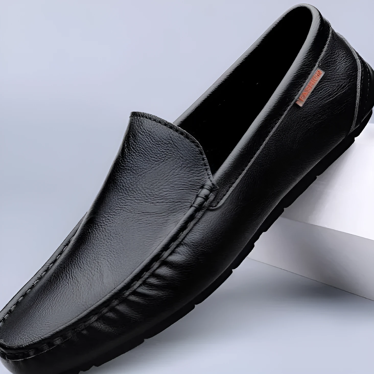 Men's casual soft leather shoes in black with visible sewing thread detail, two-layer cowhide upper, rubber sole, Korean style