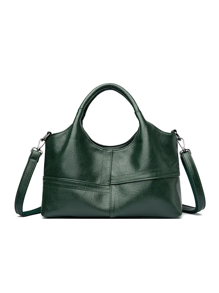 Soft leather crossbody handbag in black, bucket shape with single shoulder strap, lightweight design for women