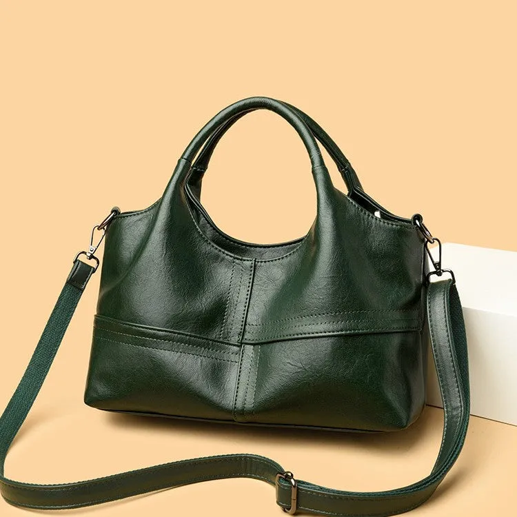 Soft leather crossbody handbag in black, bucket shape with single shoulder strap, lightweight design for women