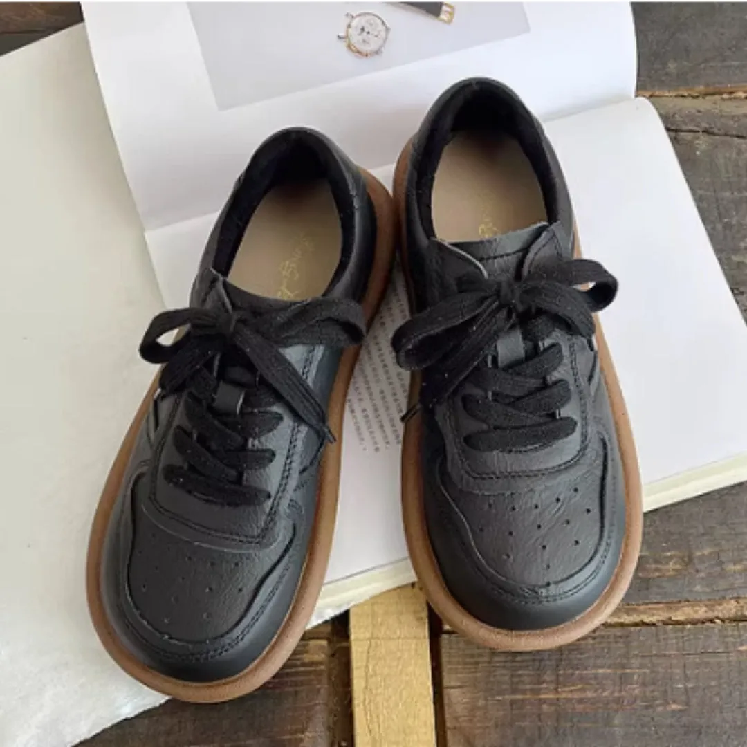 Round-toe cowhide leather lace-up flat shoes in black, soft rubber sole