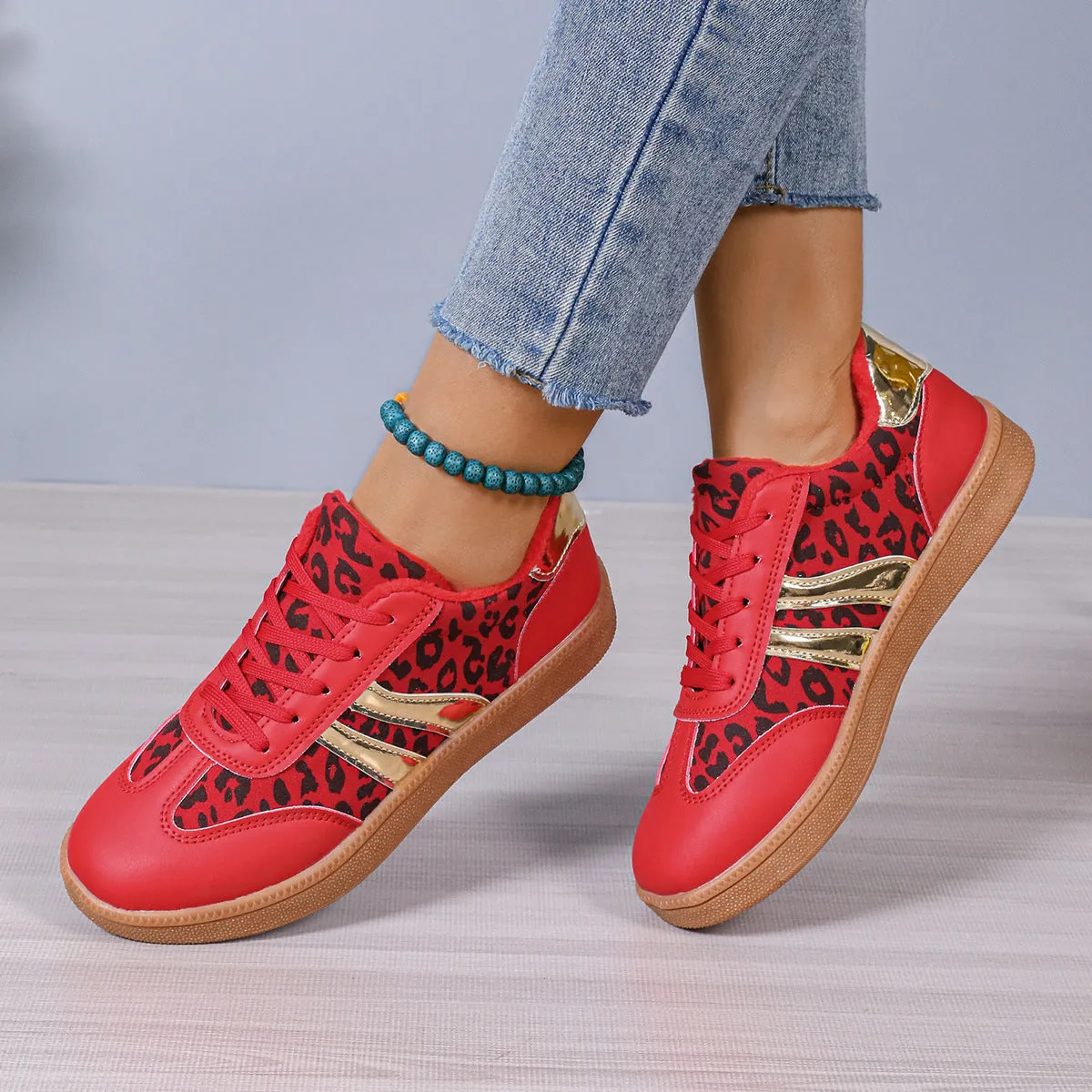 Women's casual running shoes with black microfiber upper, round toe, low top, and rubber sole against white background