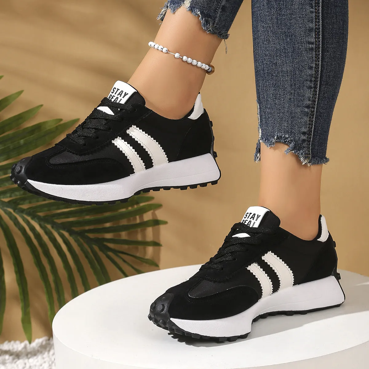 Women's thick bottom breathable casual sneakers in black with PU upper and flat heel