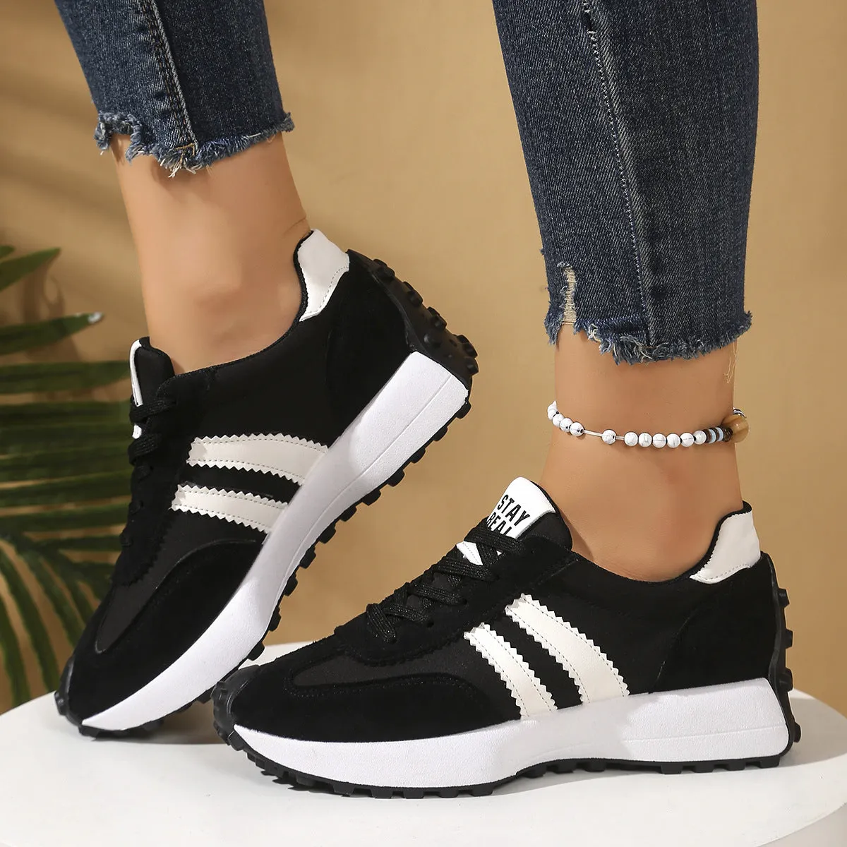 Women's thick bottom breathable casual sneakers in black with PU upper and flat heel