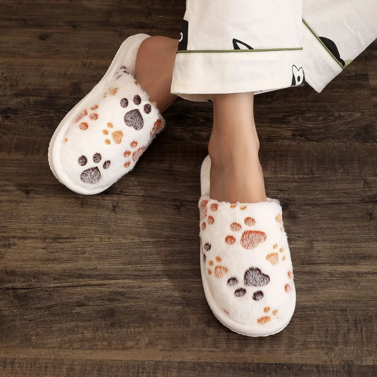 Women's cartoon print velvet cotton slippers in white with a toe holder design, shown on a plain background