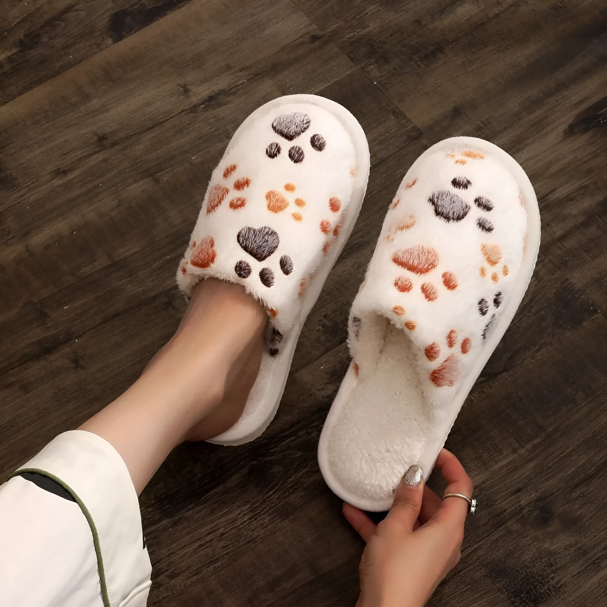 Women's cartoon print velvet cotton slippers in white with a toe holder design, shown on a plain background